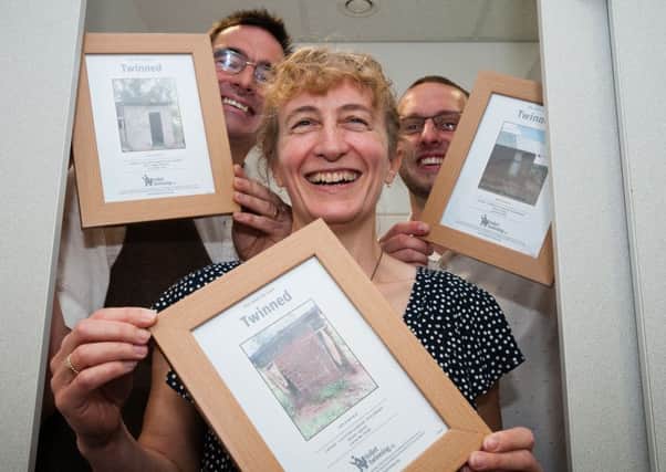 Residents of Buckshaw Village show off their twinned toilet certificates, and soon someone in Uddingston will be able to do likewise