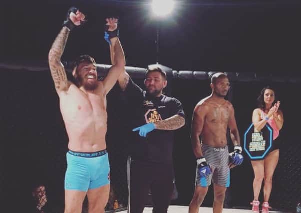 Chris Bungard celebrates after winning his European MMA title back in November (Submitted pic)