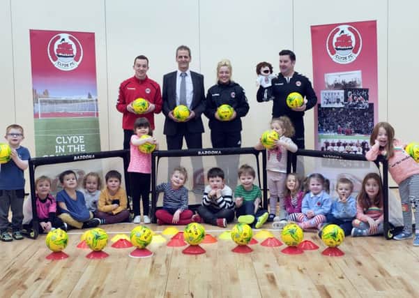 David Wilson joins Clyde FC community coaches at launch of the initiative.