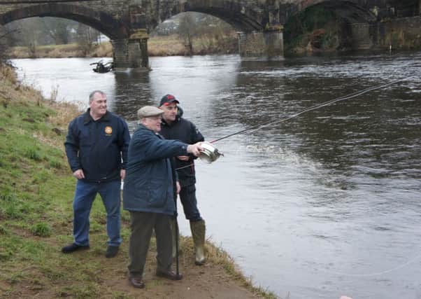 George Thompson, the oldest member of United Clyde Angling Protective Association, casts the first line at River Clyde salmon fishing season launch in Rosebank (Pic by Nigel Duncan)