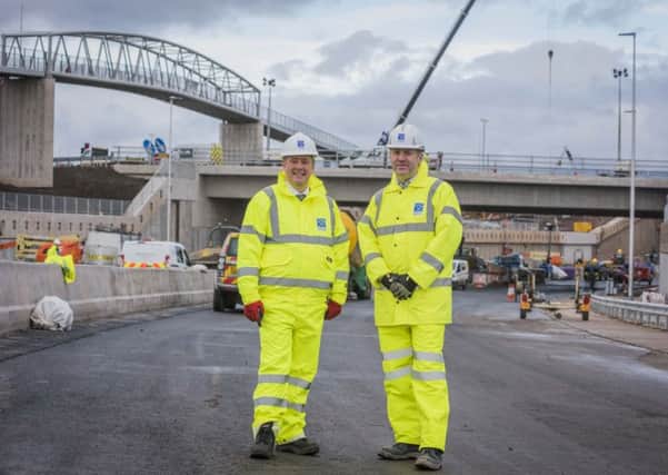 Keith Brown, the Cabinet Secretary for Economy, Jobs and Fair Work, with Graeme Reid, project manager for the M8 M73 M74 Motorway Improvements Project.
Pic: Chris Watt