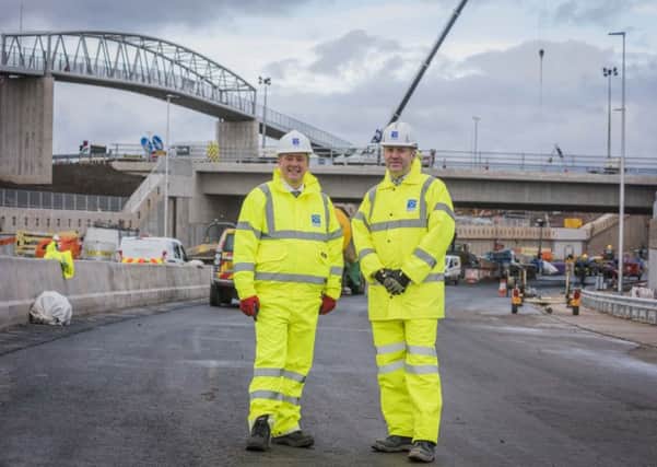 Keith Brown, the Cabinet Secretary for Economy, Jobs and Fair Work, with Graeme Reid, project manager for the M8 M73 M74 Motorway Improvements Project.

Pic: Chris Watt