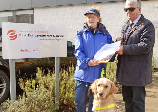 EDVIP Chairman Sandy Taylor and with vice chair Margaret Hutchieson and guide dog Bob handing over the petition in to EDC HQ with over 3500 signatures two years ago against the shared space plan.