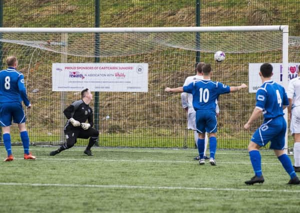 The ball nestles in the Gartcairn net after Ian Watt's stunning opening goal for Carluke Rovers (Pic by Sarah Peters)