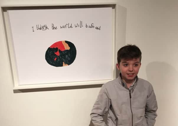 Aaron with his artwork