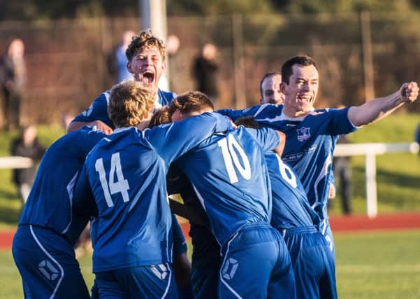 Jubilant Carluke Rovers players celebrate beating Irvine Meadow in the previous round (Pic by Sarah Peters)