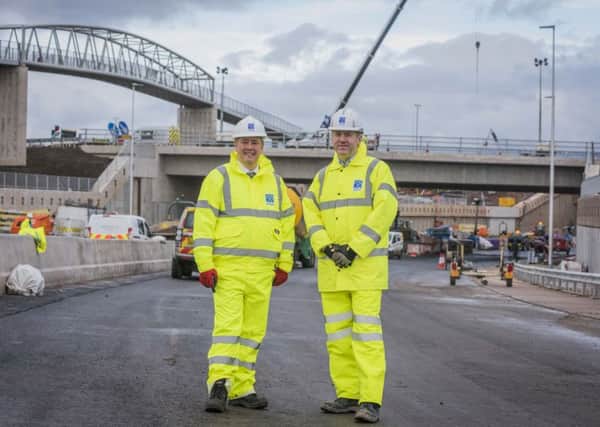 Keith Brown (left), the Cabinet Secretary for Economy, Jobs and Fair Work, on a visit to the Raith Underpass just before it opened.

Picture: Chris Watt.