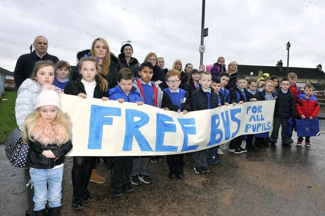 Parents and children protest outside the school