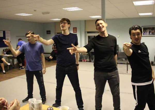 The cast of Summer Holiday during rehearsals. Fraser Morrison (2nd left) is lead, Alastair McLeod is on the left