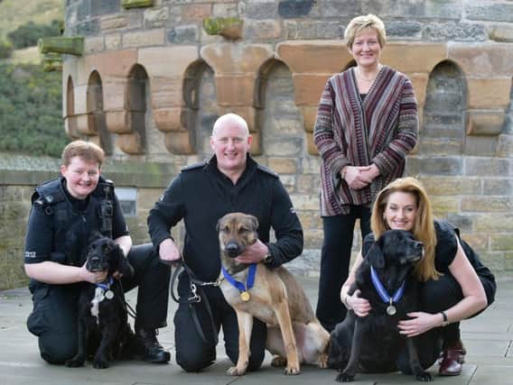 PDSADirector General Jan McLoughlin with the dogs and their handlers