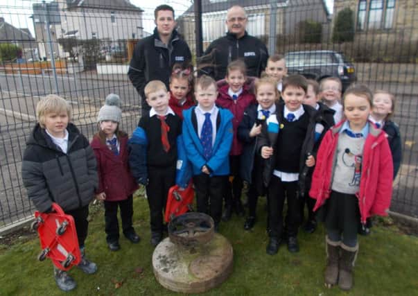 High Mill Primary School in Carluke receives an original millstone from High Mill