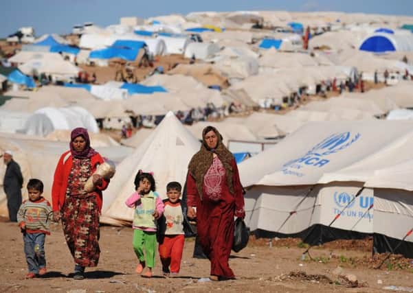 Syrian refugees in crowded camp  (Photo  BULENT KILIC/AFP/Getty Images)