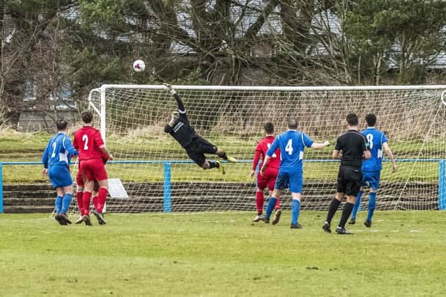 Lanark goalie Gareth Hallford makes one of several fine stops in his team's 2-1 home win over Carluke (Pic by Sarah Peters)