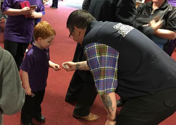 Gary Anderson with a young fan at the launch of Ashfield Darts Academy