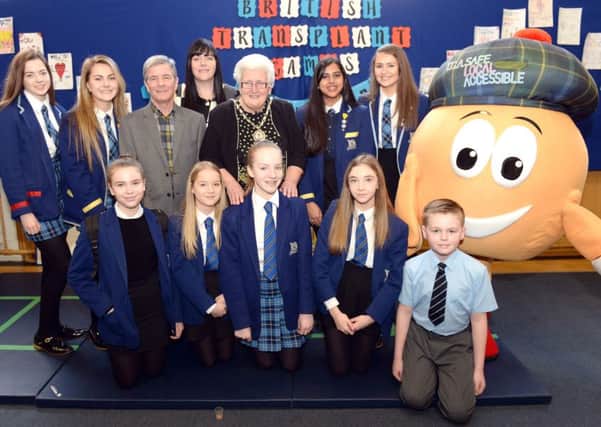Official opening...pupils with Haggi the Mascot and guests of honour when the health fayre kicked off at the school earlier this month. (Picture Alan Watson)