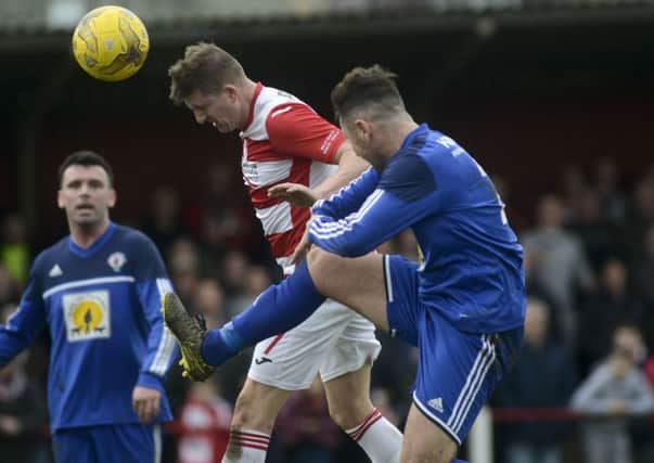 Wayne McIntosh heads home Bonnyrigg's first goal against Rob Roy
