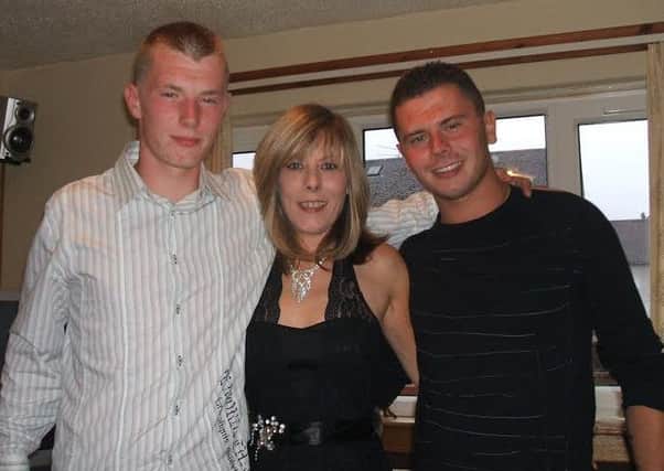 Irene with her sons Darren (left) and Ollie.
