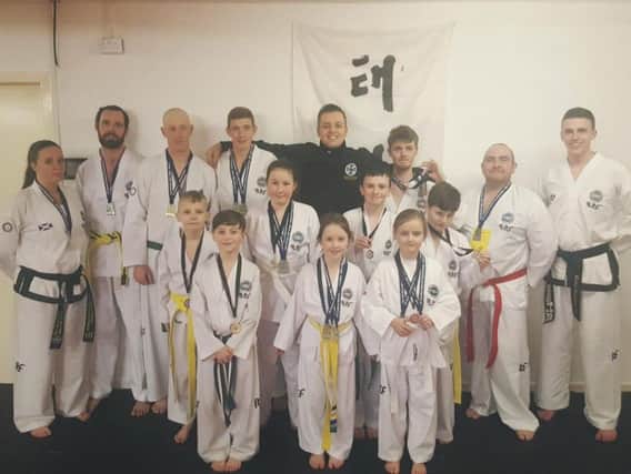 This group of GMAC Martial Arts members excelled during this months Scottish Taekwon-Do Championships. Chief instructor Chris Dickson is pictured wearing black (back row, centre), with his wife Kerris among the other students pictured. (Submitted pic)