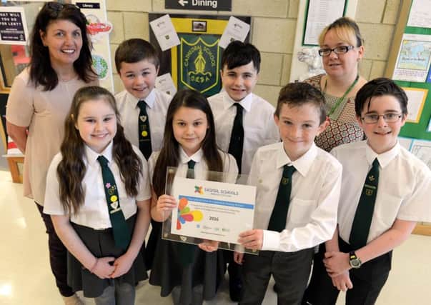 Cathedral pupils and staff show off the award