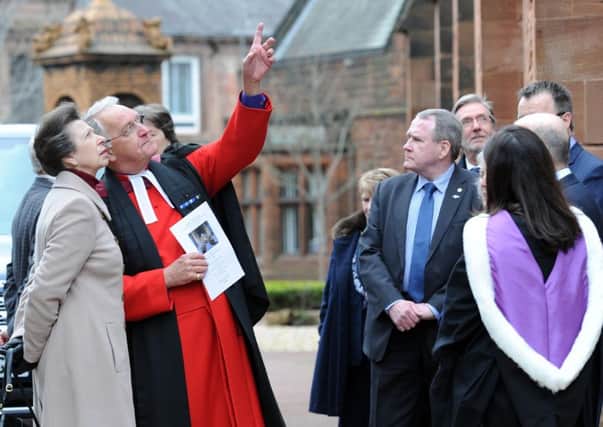 Rev Jim Gibson explains to Princess Anne where refurbishment work was carried out