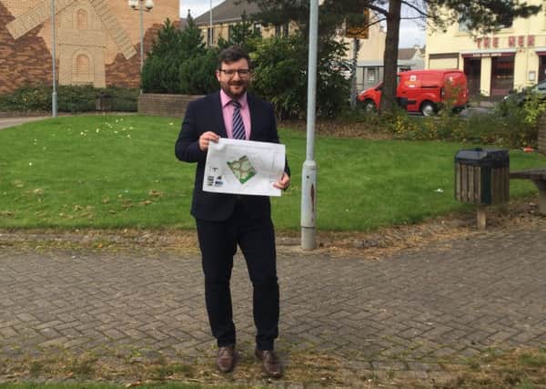 Councillor Paul Kelly with the plans for the Windmillhill Street/Camp Street improvements