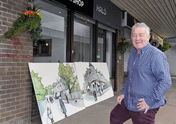 Robert Campbell who owns a barber shop is looking for a new home for his paintings.