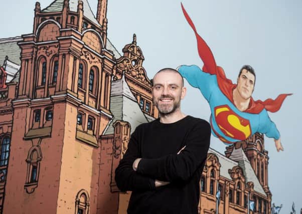 Frank Quitely with his image of Superman flying over Kelvingrove. Pic: SNS.