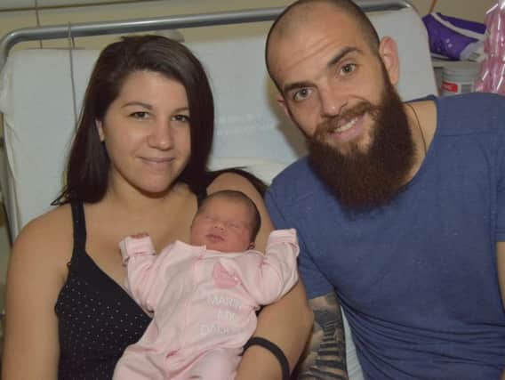 Georgios Sarris with Maria and baby Nancy