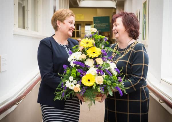 Picture - Nick Ponty - 
Lord Provost Sadie Doherty is presented with flowers by 
Rhona Baillie, CEO of the Prince and Princess of Wales Hospice.