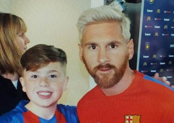 James Ramsay with one of his football heroes, Lionel Messi