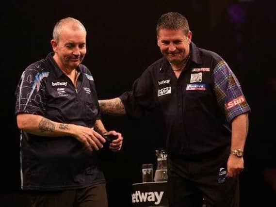 Gary Anderson (right) with fellow darts grea Phil Taylor