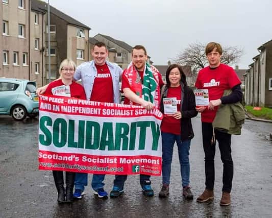 Kevin Kane (second left) in Kilsyth with members of his campaign team