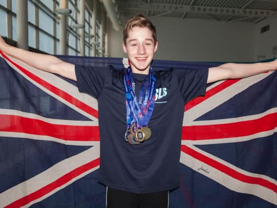 Mark Ford holds the Union Jack as he looks set to become Lanark Swimming Clubs first British age group record holder (Pics by Stuart Stevenson)