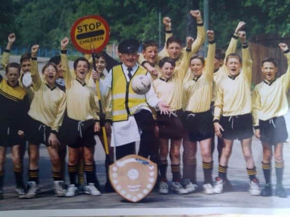 Mark (back row, directly right of lollipop man) is pictured with his Uddingston Grammar classmates after winning the 1992 Scottish Schools Shield