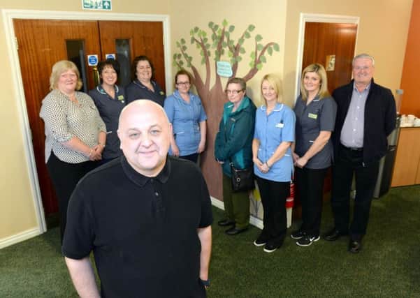 Tommy Whitelaw (front) from Dementia Carer Voices unveiled the artwork in the reception of Hatton Lea as he tours hundreds of establishments to highlight the need for greater awareness on dementia