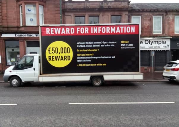 A trailer advertising the Â£50,000 reward was set up in Main Street, Bothwell, at the weekend after the householder hired a firm of private investigators to get to the bottom of the break-in