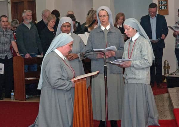 Sister Stacey Angela Cameron professes her vows before delegate Sister Joan with Sisters Editta and Monica as witnesses. Pic: Tom Eadie