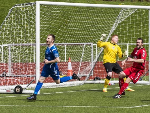 Carluke Rovers ace Ian Watt wheels away to celebrate after scoring his sides second goal in the win over East Kilbride (Pic by Sarah Peters)