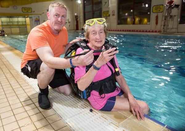 Thistle Divers member Anna Illington who learned to dive after she retired, is 81 now and still diving all over the world. In the pool at Kilsyth Leisure centre with Rob Sewell, Diving Officer at Thistle Divers. 
Picture Robert Perry 24th April 2017

Must credit photo to Robert Perry

www.robertperry.co.uk

NB -This image is not to be distributed without the prior consent of the copyright holder.
in using this image you agree to abide by terms and conditions as stated in this caption.
All monies payable to Robert Perry

(PLEASE DO NOT REMOVE THIS CAPTION)
This image is intended for Editorial use (e.g. news). Any commercial or promotional use requires additional clearance. 
Copyright 2016 All rights protected.
first use only
contact details
Robert Perry     
07702 631 477
robertperryphotos@gmail.com
       
Robert Perry reserves the right to pursue unauthorised use of this image . If you violate my intellectual property you may be liable for  damages, loss of income, and profits you derive from the use of this