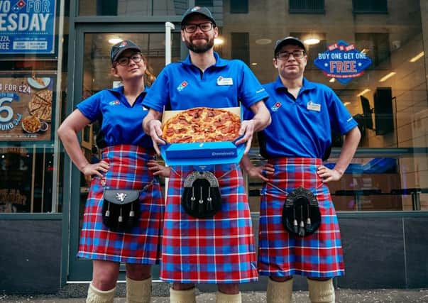 Dominos has celebrated the opening of a new store in Glasgow Central by unveiling its own family tartan. Photo: Mikael Buck.
