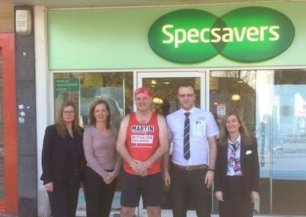 Martin Kerr with staff from Specsavers.