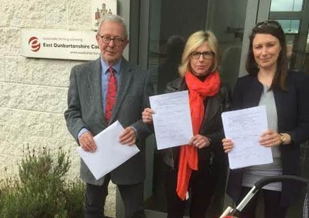 Jim Goodall, prospective Liberal Democrat councillor with Alison Lapping and Alison Emery handing over their petition at the council headquarters.