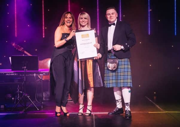 Kathleen Swallow (centre) accepts her award from host Carol Smillie and Christopher Coates, editor of Scotland Magazine. Photo by Dom Martin.