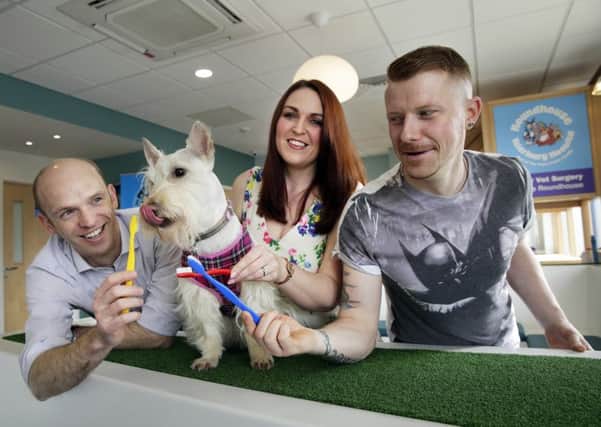 Ross Allan (left) with Graeme and Suzanne Banks and daughter Lilyanna (4) and their Scottie dog Nessie