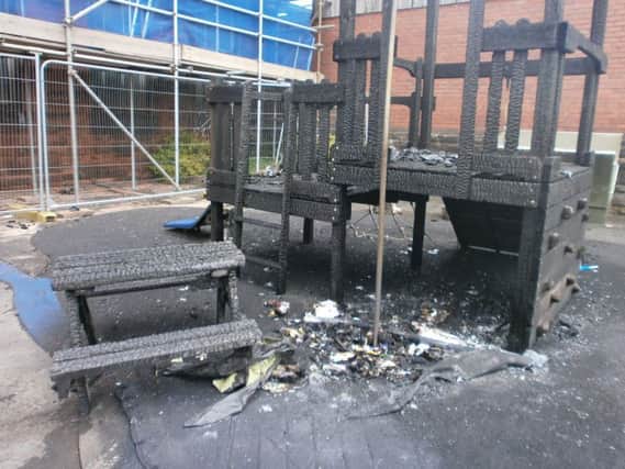 The charred remains of the climbing frame