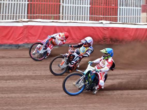 Tigers riders Summers (red) and Bewley (blue) in derby action. Pic by George Mutch