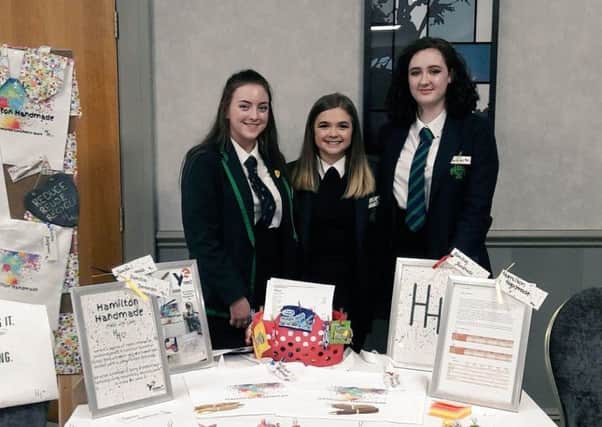 Pupils Claire Finnigan, Bethany Lloyd and Charlotte Millar, from Hamilton Grammar School with their products.