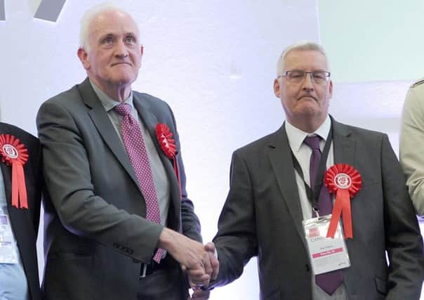 Barry McCulloch (left) congratulates Tom Fisher