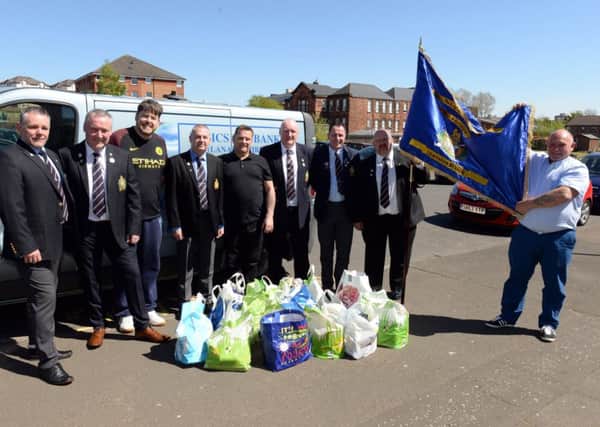 Former soldiers with their food bank donations