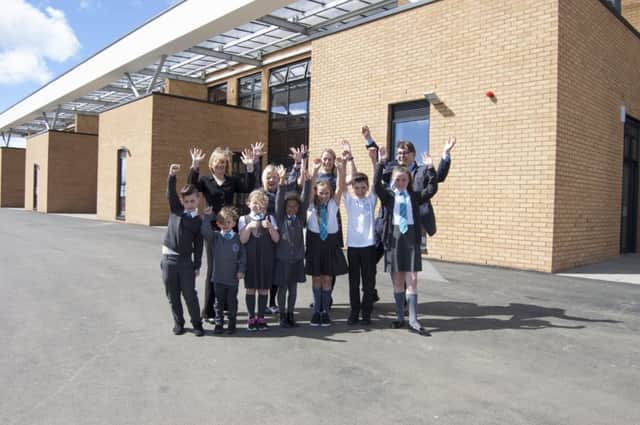 Pupils outside the new school
